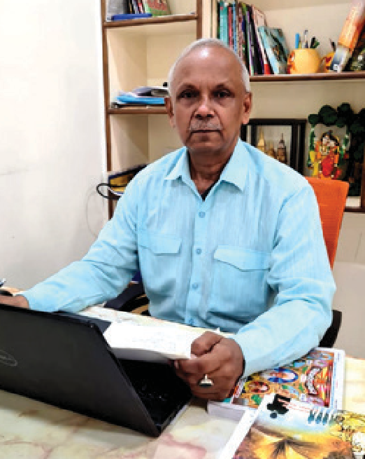 Dr. Bipin Bihari Lal at his consultation desk, as printed with the published profile.